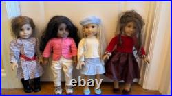10 Pre-Owned American Girl Dolls with clothes, accessories, and stroller