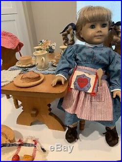 Retired American girl doll Kirsten with trunk, outfits, furniture, accessories